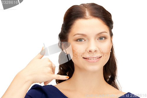 Image of woman making a call me gesture