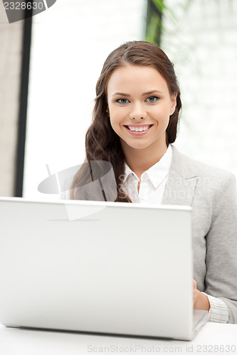 Image of happy woman with laptop computer