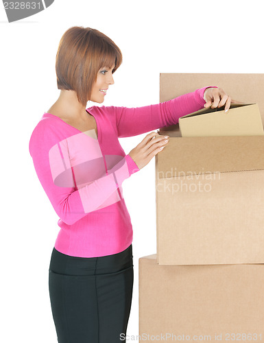 Image of attractive businesswoman with big boxes