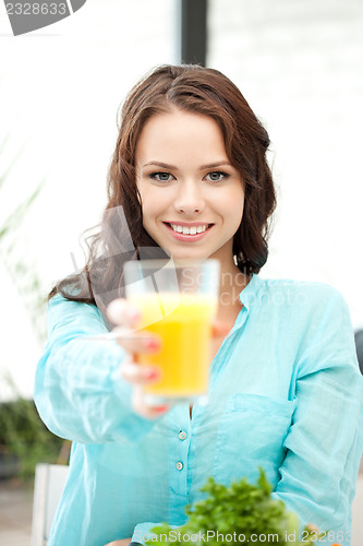 Image of beautiful woman with glass of juice