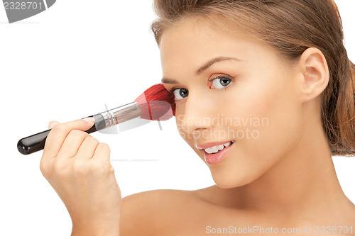 Image of beautiful woman with brush