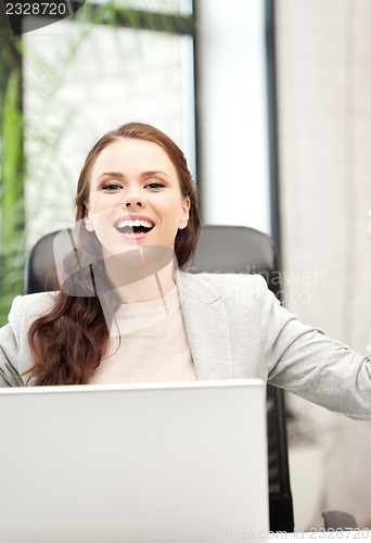 Image of happy woman with laptop computer