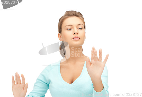 Image of businesswoman working with something imaginary
