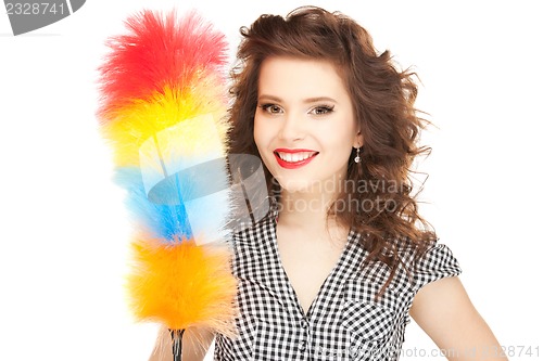 Image of beautiful woman with cleaning sweep