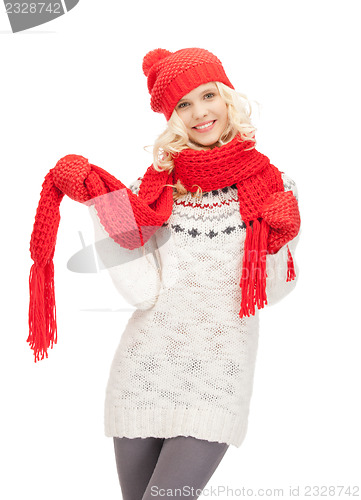 Image of beautiful woman in hat, muffler and mittens