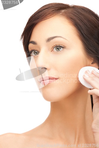Image of beautiful woman with cotton pad