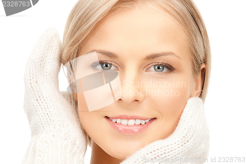 Image of beautiful woman in mittens