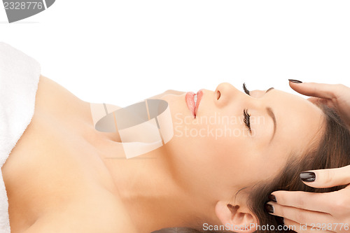 Image of beautiful woman in massage salon