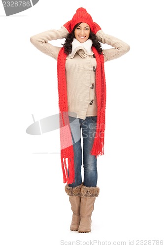 Image of beautiful woman in hat, muffler and mittens