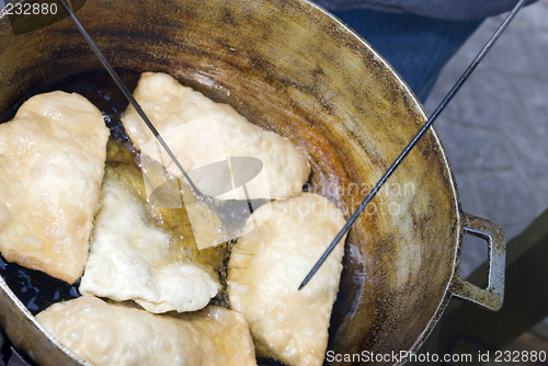 Image of empanadas cooking