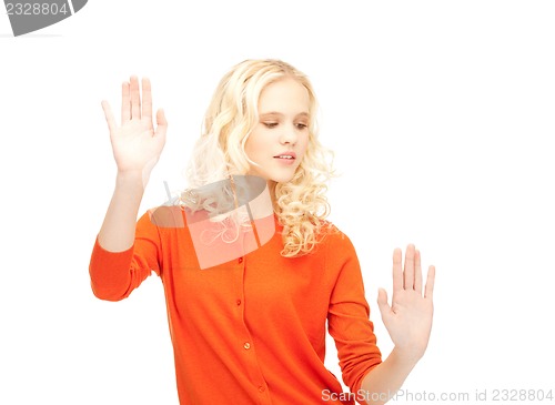 Image of businesswoman working with something imaginary