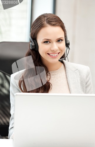 Image of helpline operator with laptop computer