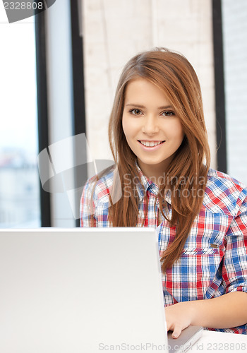 Image of happy woman with laptop computer