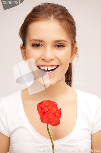 Image of beautiful woman with red flower