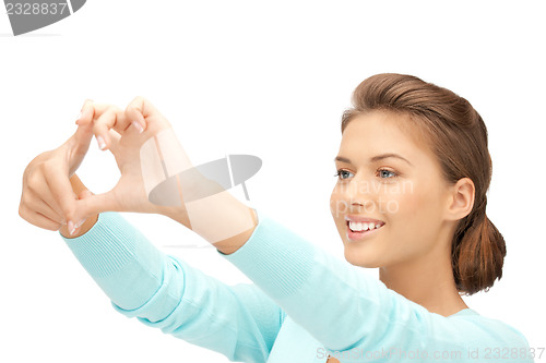 Image of lovely woman creating a frame with fingers