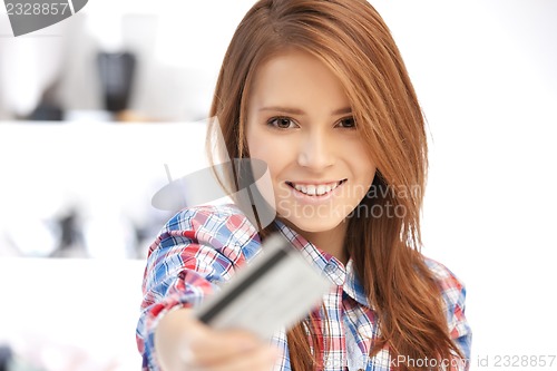 Image of happy woman with credit card