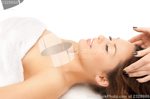 Image of beautiful woman in massage salon