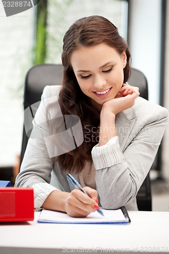 Image of happy woman with big notepad