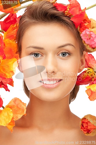 Image of lovely woman with red flowers