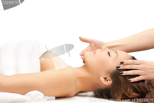 Image of beautiful woman in massage salon