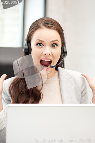 Image of helpline operator with laptop computer