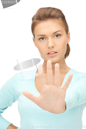 Image of woman making stop gesture