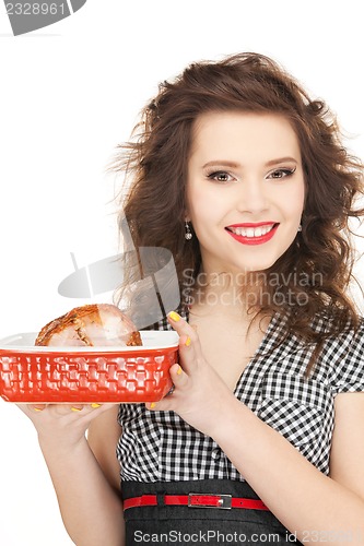 Image of lovely housewife with meat