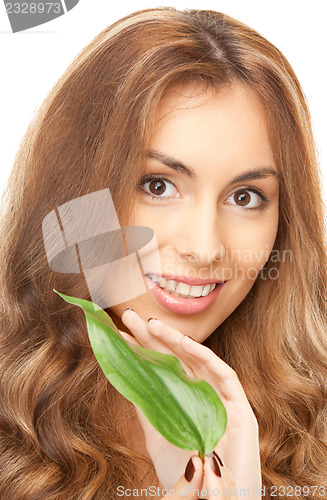 Image of woman with green leaf