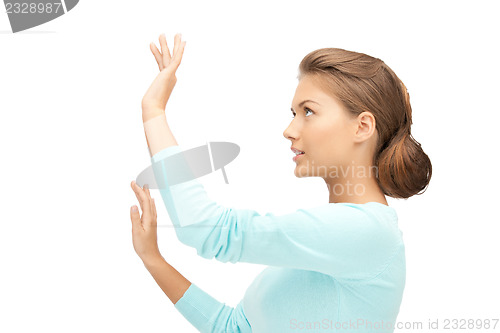 Image of businesswoman working with something imaginary