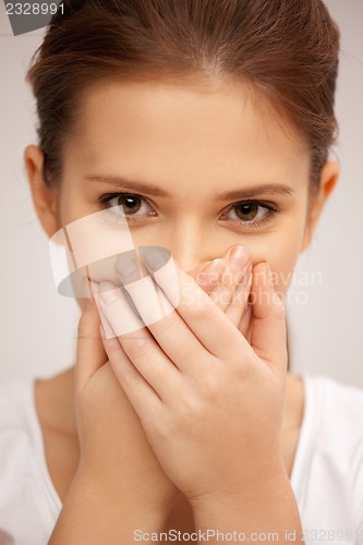 Image of woman with hand over mouth