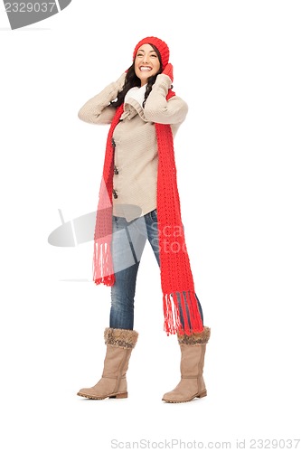 Image of beautiful woman in hat, muffler and mittens