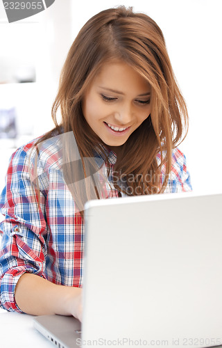 Image of happy woman with laptop computer