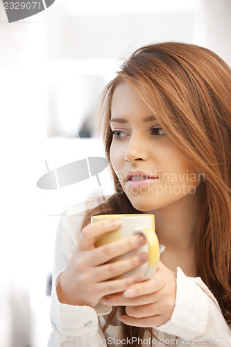 Image of lovely woman with mug