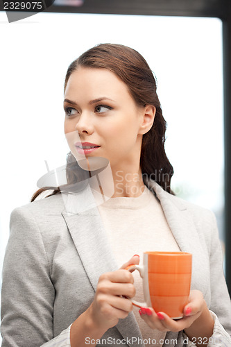 Image of lovely businesswoman with mug