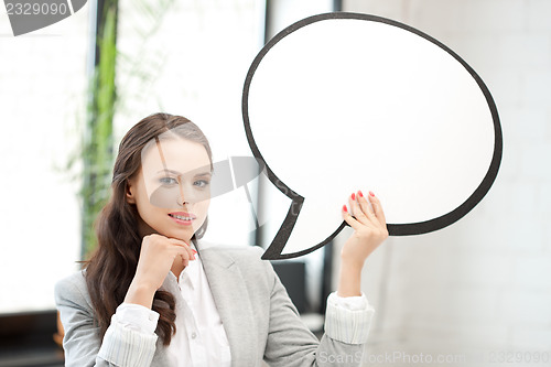 Image of smiling businesswoman with blank text bubble