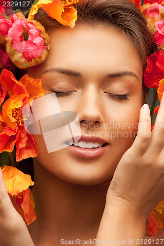 Image of lovely woman with red flowers