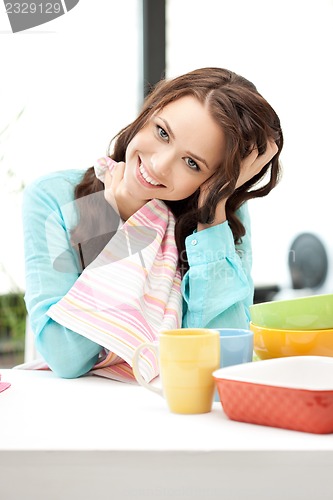 Image of lovely housewife at the kitchen