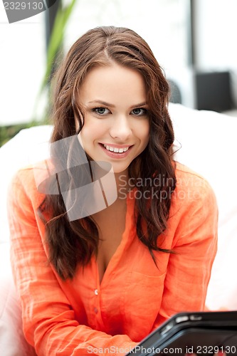 Image of happy woman with tablet pc computer