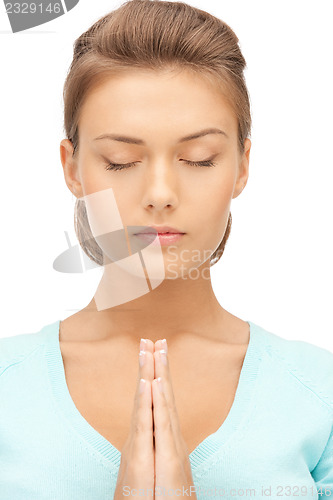 Image of praying businesswoman