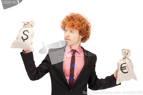 Image of man with euro and dollar bags