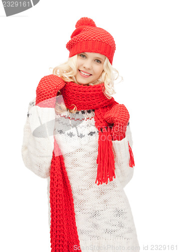 Image of beautiful woman in hat, muffler and mittens