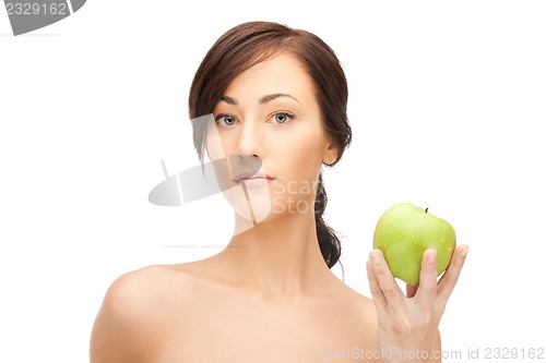 Image of young beautiful woman with green apple