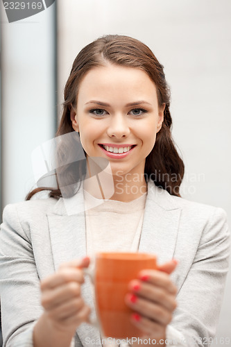 Image of lovely businesswoman with mug