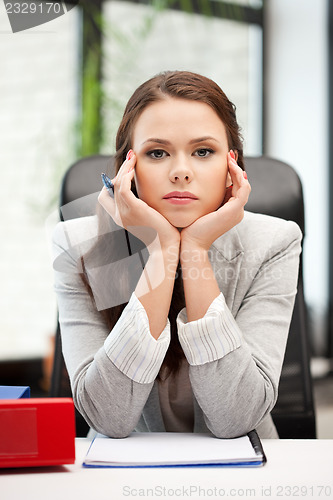 Image of calm woman with big notepad