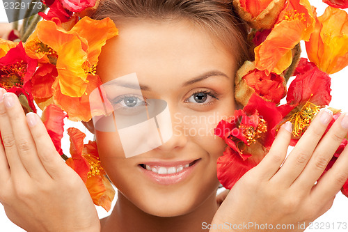 Image of lovely woman with red flowers