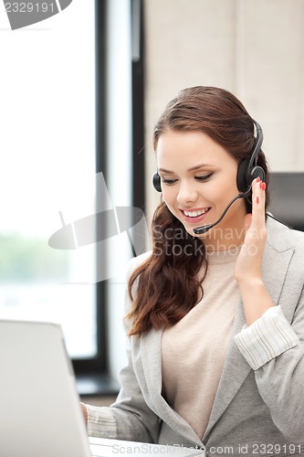 Image of helpline operator with laptop computer