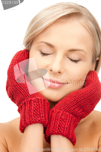 Image of beautiful woman in mittens