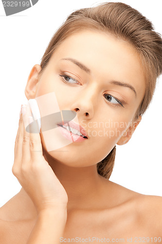 Image of beautiful woman with cotton pad