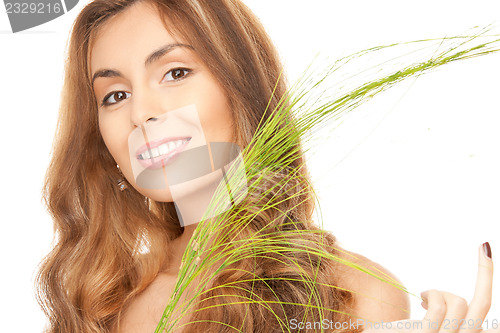 Image of woman with green sprout