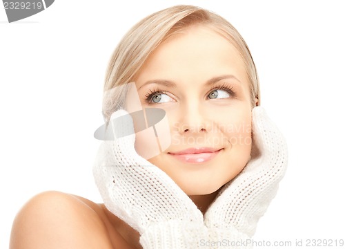 Image of beautiful woman in mittens